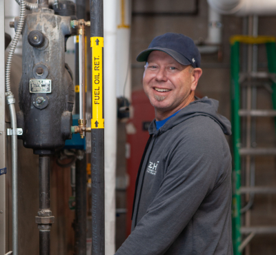 Student working on mechanical equipment