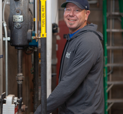 Student working on mechanical equipment